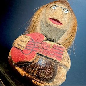 hand carved coconut figure with glasses & guitar